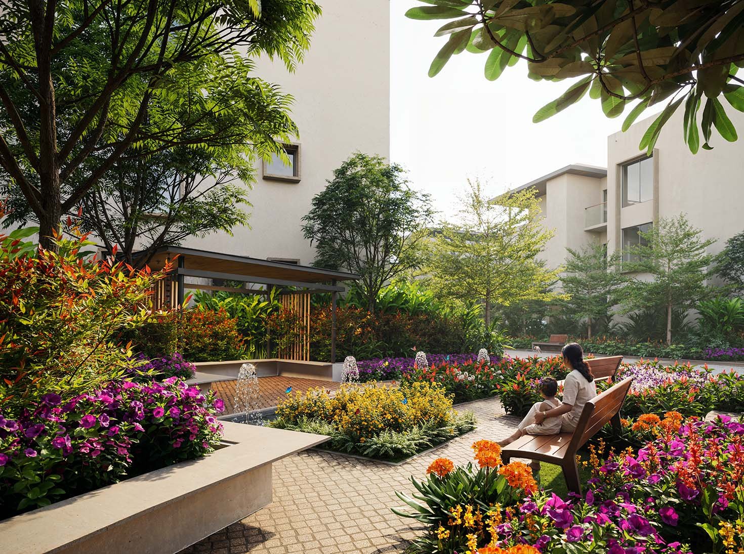 Garden court between the residences, dense with colour, shade and a small fountain